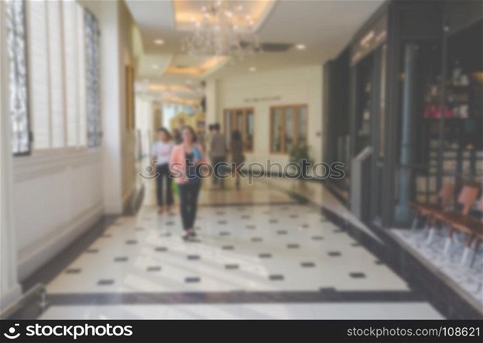Abstract blur people in shopping mall and department store interior for background.Use as background image.