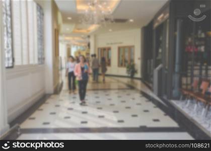 Abstract blur people in shopping mall and department store interior for background.Use as background image.