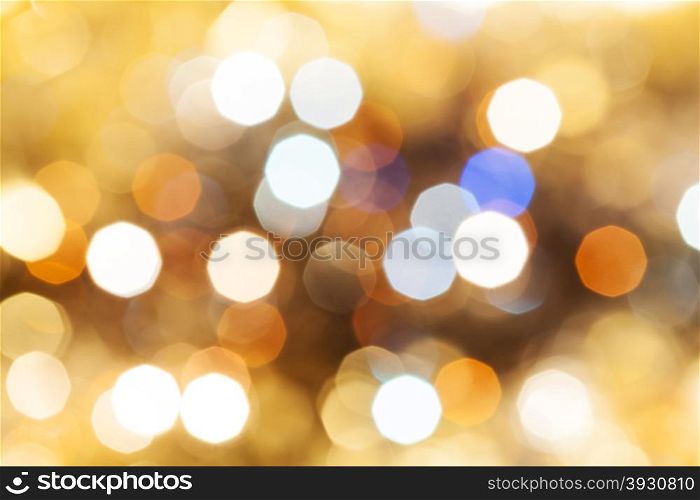 abstract blurred background - blue and brown shimmering Christmas lights bokeh of electric garlands on Xmas tree