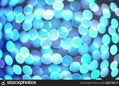 Abstract blurred background, defocused turquoise blurred lights Bokeh on black background. Glittering, glowˆ≤pattern. Festive wallpaper, backdrop