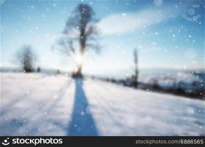 Abstract blurred background of beautiful winter mountain snowy alpine landscape