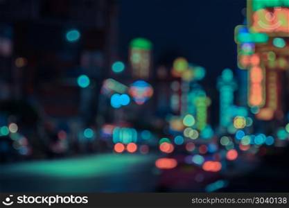 Abstract blurred background of China town nightlife with colorful neon signs. China town is one of the most popular place of night street food in Bangkok, Thailand