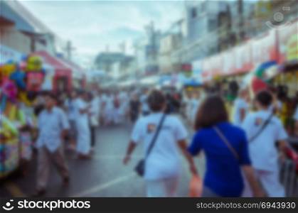 Abstract blurred background people walking in the old city of Phuket, Thailand.