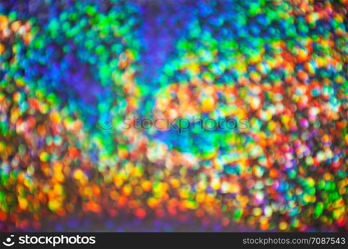 Abstract blurred background with numerous colourful bright festive bokeh. Texture with copy space for text. Celebration, holidays concept. Horizontal and vertical
