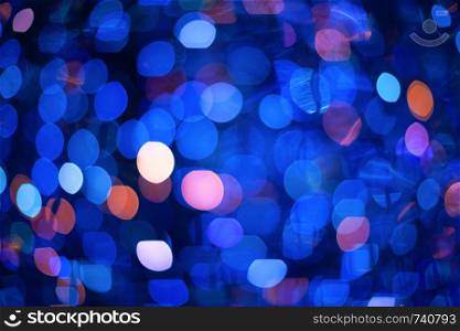 Abstract blurred background with numerous colourful bright festive bokeh. Texture with copy space for text. Celebration, holidays concept. Horizontal