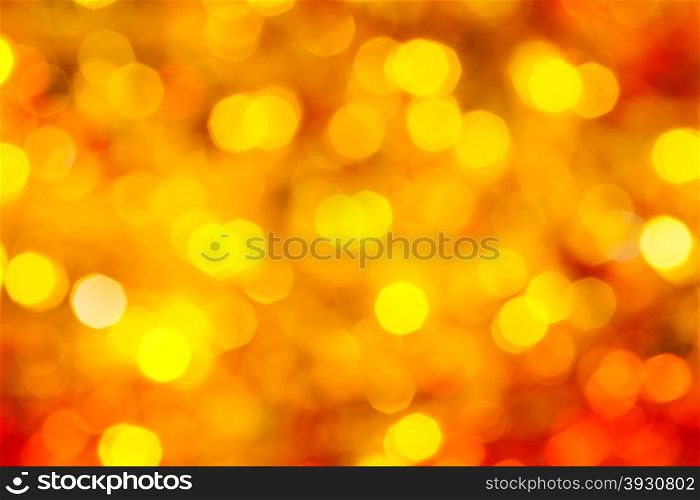 abstract blurred background - yellow and red flickering Xmas lights bokeh of garlands on Christmas tree