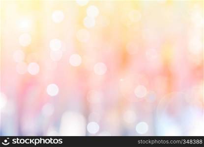Abstract blurred bokeh on yellow and pink background with lens flare