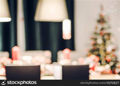abstract blurred Christmas tree decoration with string light at kitchen in house with bokeh background,winter holiday season celebration festival backdrop.