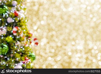 Abstract blurred christmas tree on gold bokeh background