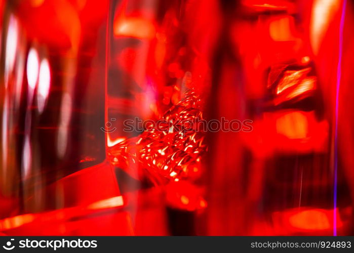 abstract blurred Close up Color detail on the Rear front light of a car