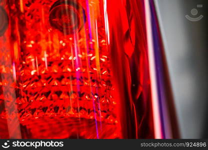 abstract blurred Close up Color detail on the Rear front light of a car