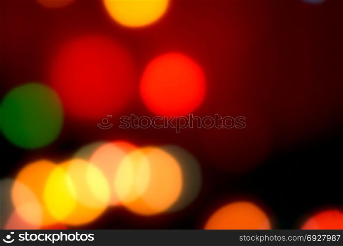 Abstract blurred dark background with red and yellow bokeh spots