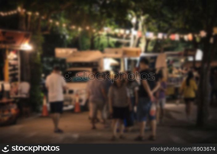 Abstract blurred food truck festival - vintage tone ,as background.