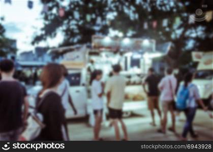 Abstract blurred food truck festival - vintage tone ,as background.