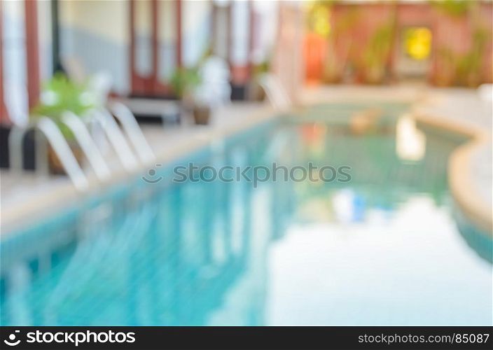 Abstract blurred image of outdoor swimming pool for background