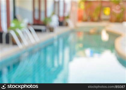 Abstract blurred image of outdoor swimming pool for background