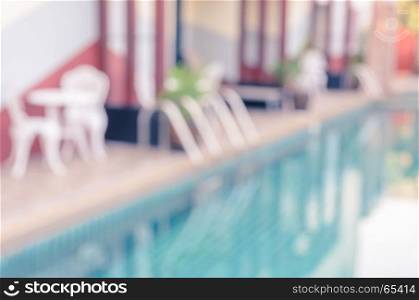 Abstract blurred image of outdoor swimming pool for background. Vintage filtered effect image