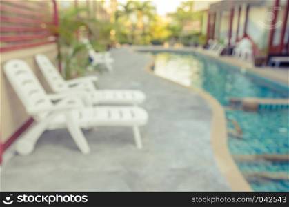 Abstract blurred image of outdoor swimming pool for background. Vintage filtered effect image