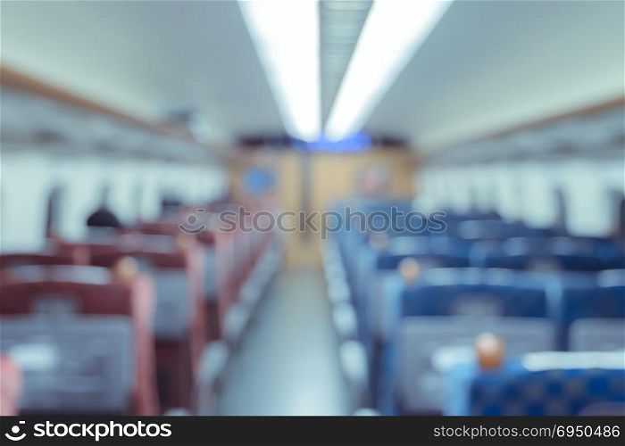 Abstract blurred Interior of a passenger car background. Travel concept with public train transport.