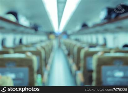 Abstract blurred Interior of a passenger car background. Travel concept with public train transport.