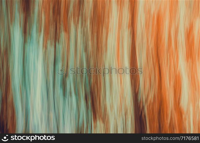Abstract blurred landscape with movement effect. Background with directional blur, motion effect and long exposure. Vertical lines and strips.