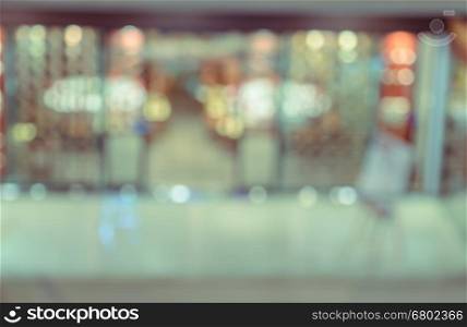 Abstract blurred night shop window with colorful bokeh lights for background