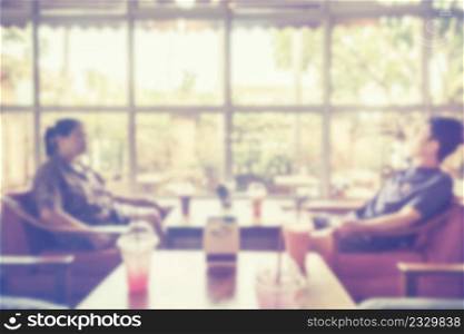 abstract blurred people in coffee shop with vintage tone.