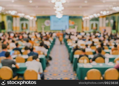 Abstract blurred photo of conference hall or seminar room with attendee background