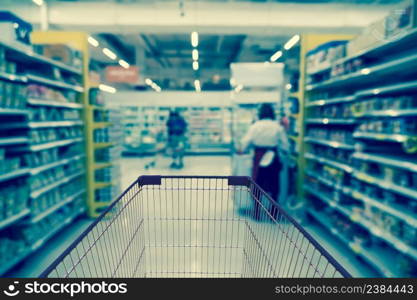 Abstract blurred photo of store with trolley in department store bokeh background, business supermarket and shopping blurred and background concept