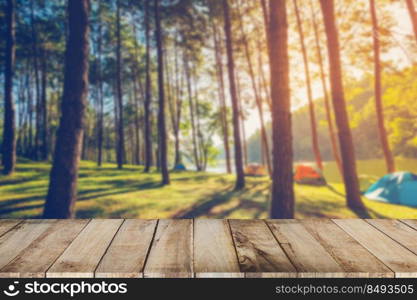 Abstract blurred pine tree and wood table with sunlight vintage