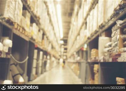 Abstract blurry background of warehouse storing with a lot of large box stack