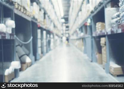 Abstract blurry background of warehouse storing with a lot of large box stack