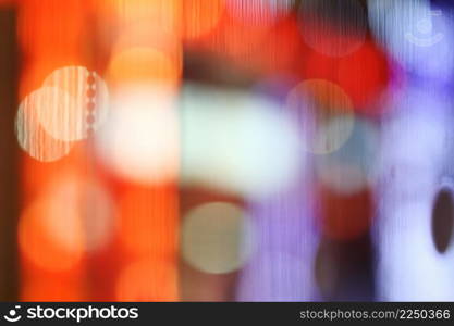 Abstract blurry bokeh reflected on glass background