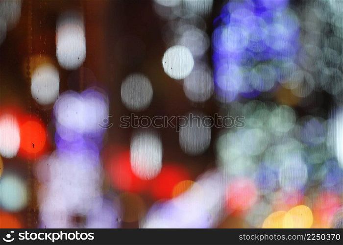 Abstract blurry bokeh reflected on glass background