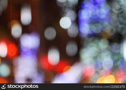 Abstract blurry bokeh reflected on glass background