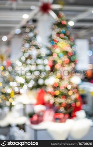 abstract bokeh christmas tree decorate with ball and string lights.Holiday celebration festival