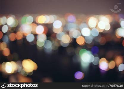 Abstract bokeh cityscape of Bangkok night background with retro filter effect