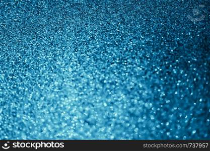 Abstract bokeh glitter background. Defocused background. Blurred bright light on black for overlay texture