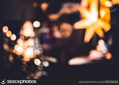 abstract bokeh living room decorate with ball and string lights at night chrismas time.Holiday celebration festival