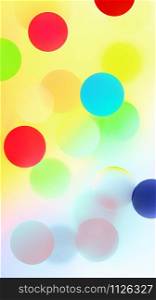 Abstract bright colorful pattern with multicolored bubbles and confetti. Creative festive blurred background for digital wallpaper or print and web design. Space for copy.