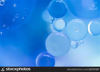 abstract bubbles blue colored blurred background