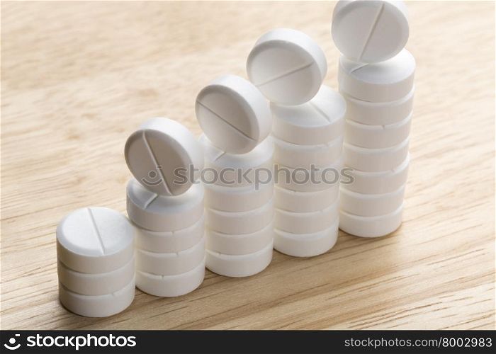 Abstract chart of white pills. Abstract chart of white pills on a gray background