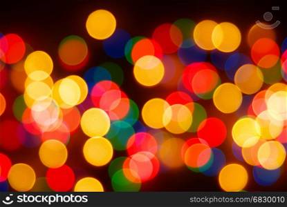 Abstract christmas lights as background on black