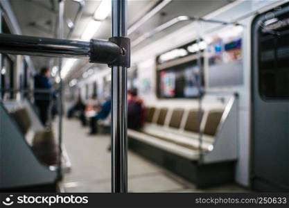 Abstract chrome handrails in subway wagon interior