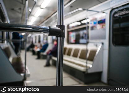 Abstract chrome handrails in subway wagon interior