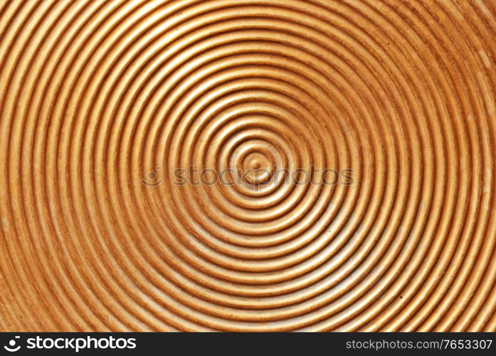 Abstract circle metal plate- golden surface with round lines.