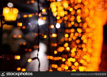 Abstract circular bokeh background of Christmaslight. bokeh from garlands. background for screensaver. Defocused lights. Blurred bokeh with yellow color lights. Abstract circular bokeh background of Christmaslight. bokeh from garlands. background for screensaver. Defocused lights. Blurred bokeh with yellow color lights.