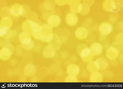 Abstract circular gold and yellow light bokeh background
