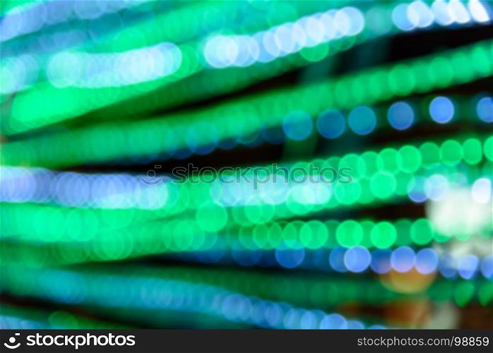 Abstract circular green and blue light bokeh background