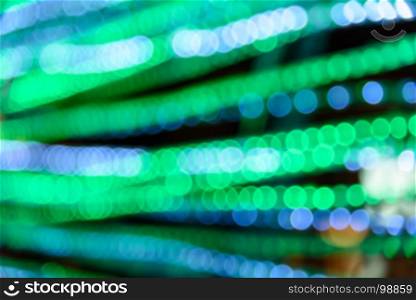 Abstract circular green and blue light bokeh background
